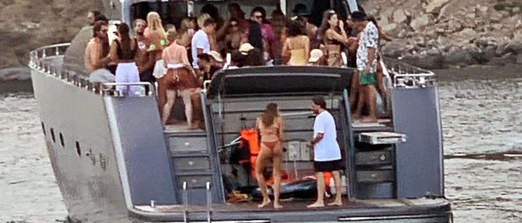 Crowded yacht party on the coast of Ibiza