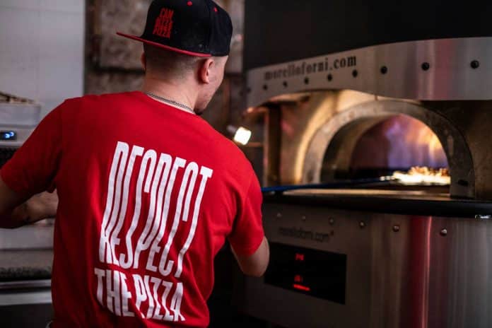 Slow cooking to achieve the perfect crispy base on each pizza.