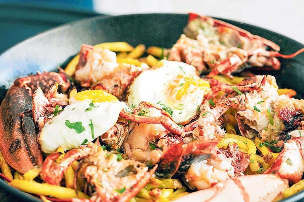 Lobster with fried eggs and potatoes features on the menu at many high-end restaurants.