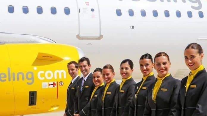 Vueling accepts and will pay the fine for requiring heels, makeup and mascara on flight attendants