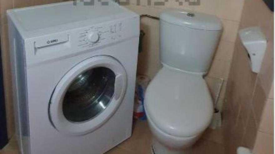Putting the washing machine sitting on the toilet for 1,400 euros in Ibiza