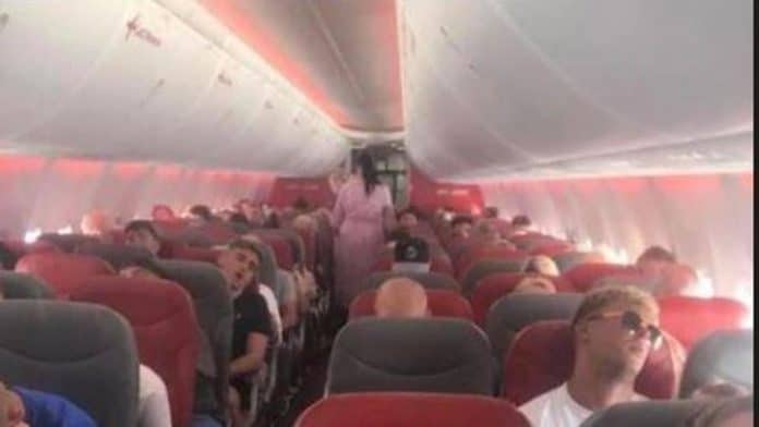 All sleeping on a return flight after a vacation in Ibiza