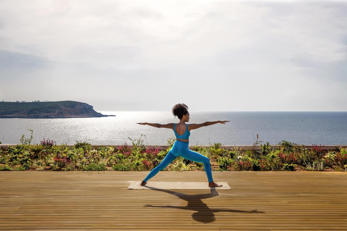 One Of The Yoga Classes Overlooking The Bay Of Cala Xarraca At Six Senses Ibiza.