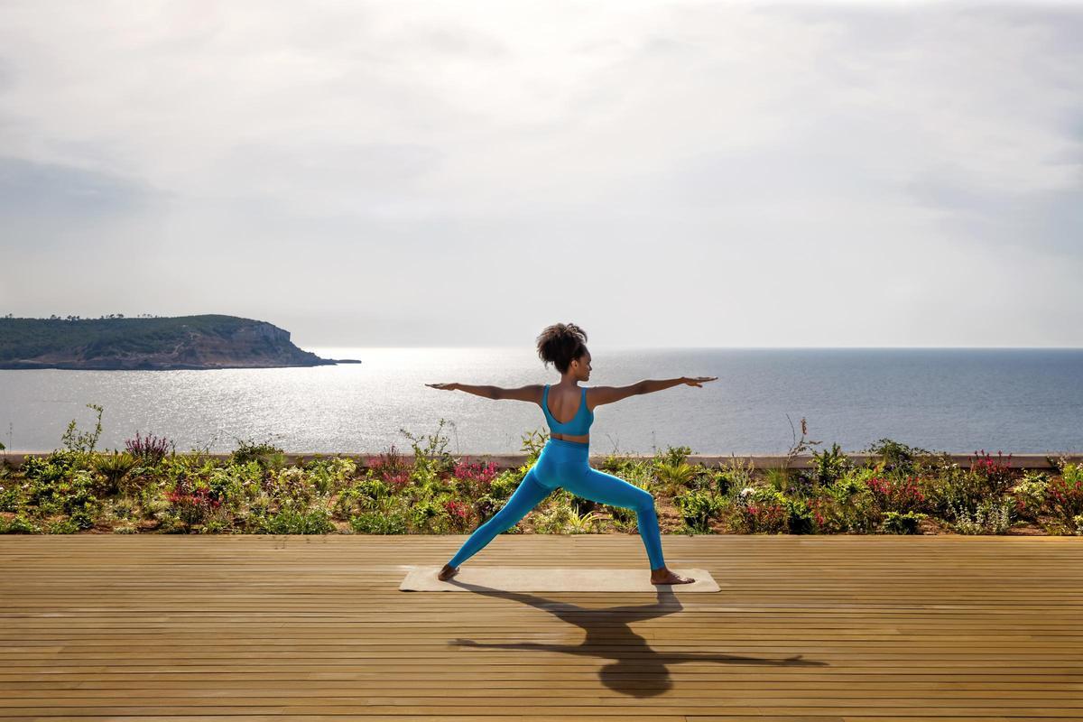 One of the yoga classes overlooking the bay of Cala Xarraca at Six Senses Ibiza.