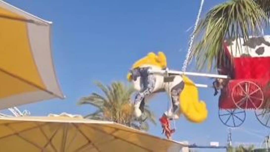 A dancer falls to the ground from a great height during a show for tourists at a club in Ibiza