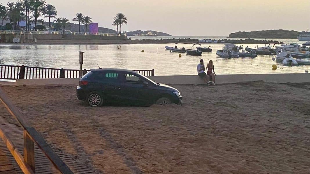 Abandoned rental car trapped in the sand of Platja d’en Bossa