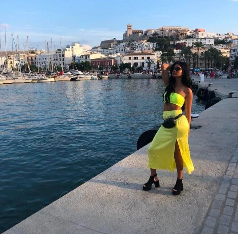 Sthefany in the port of Ibiza with Dalt Vila in the background.