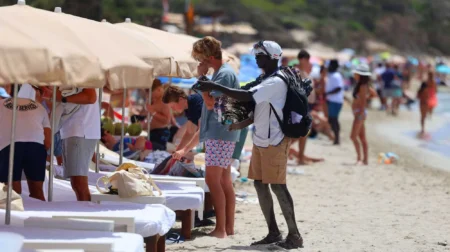 The Daily Illegal Marketplace Taking Over Ibiza’s Ses Salines Beach