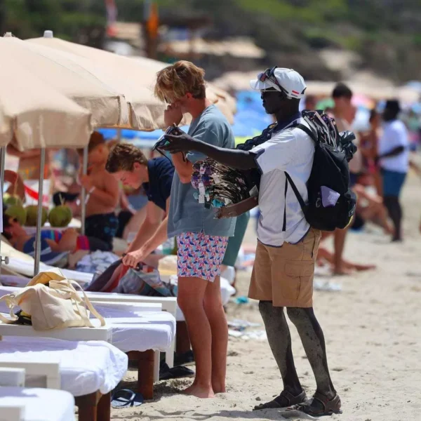 The Daily Illegal Marketplace Taking Over Ibiza’s Ses Salines Beach