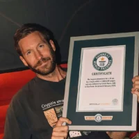Calvin Harris shows off his Guinness World Records certificate. | @CalvinHarris